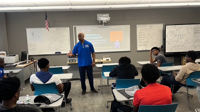 Willie Worley delivering The Crossover presentation to students