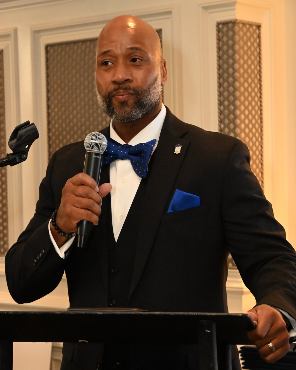 Willie Worley speaking at a podium